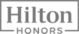 This image features the "Hilton Honors" logo, displayed in a simple black and white design within a rectangular border.