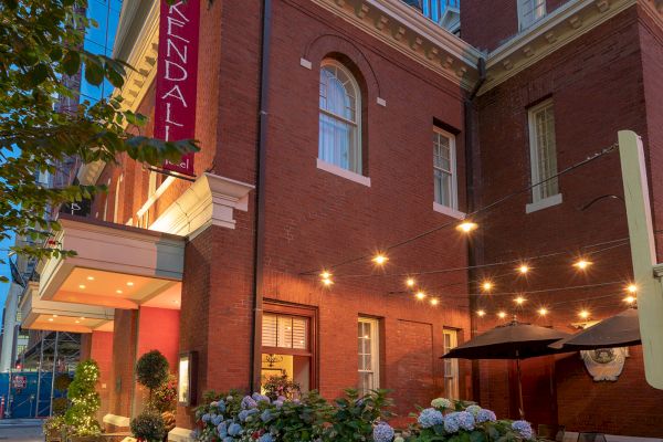 A charming brick building with a lit-up 